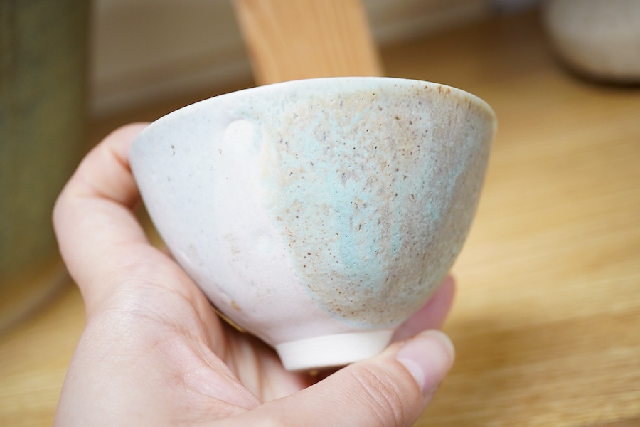 Mary White (1926-2013), a thinly-potted bowl with turquoise and pink glaze effects, monogrammed, 9cm diameter
